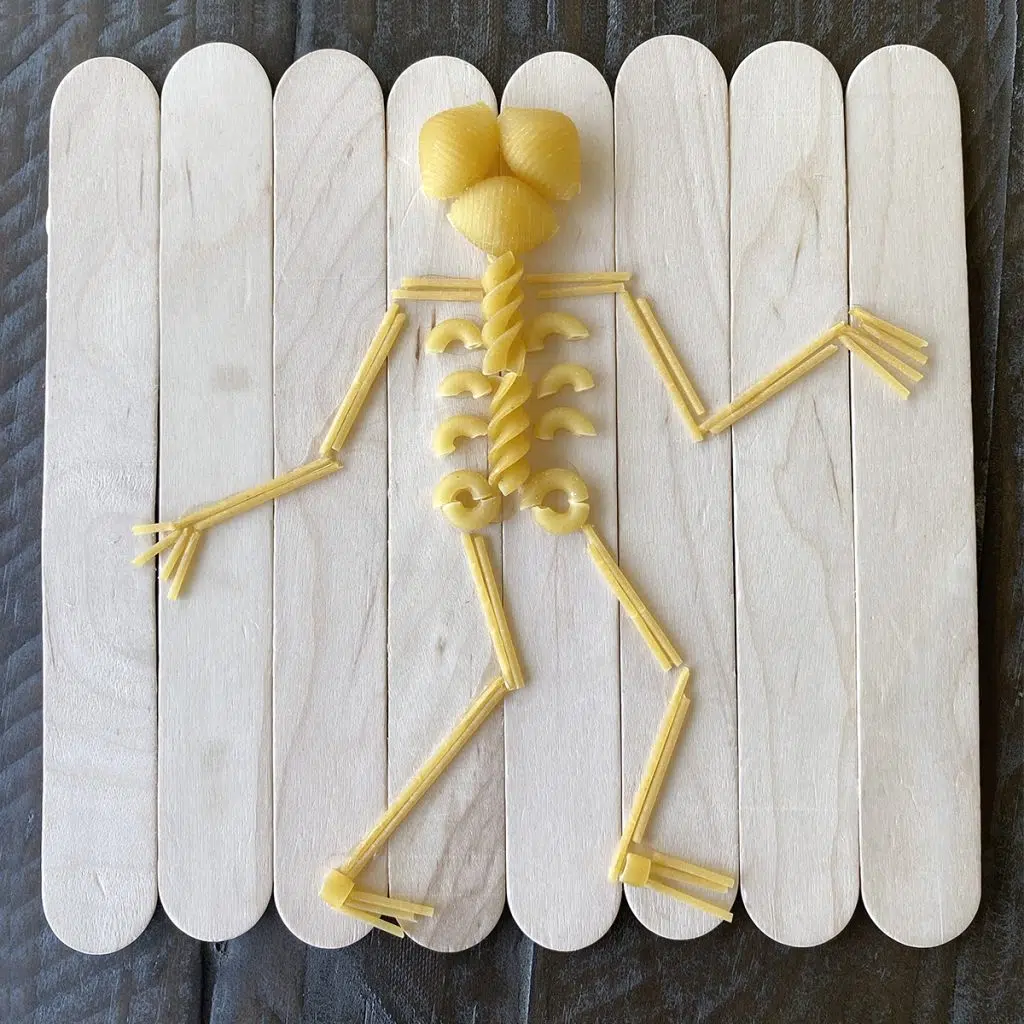 Pasta skeleton craft made with jumbo craft sticks